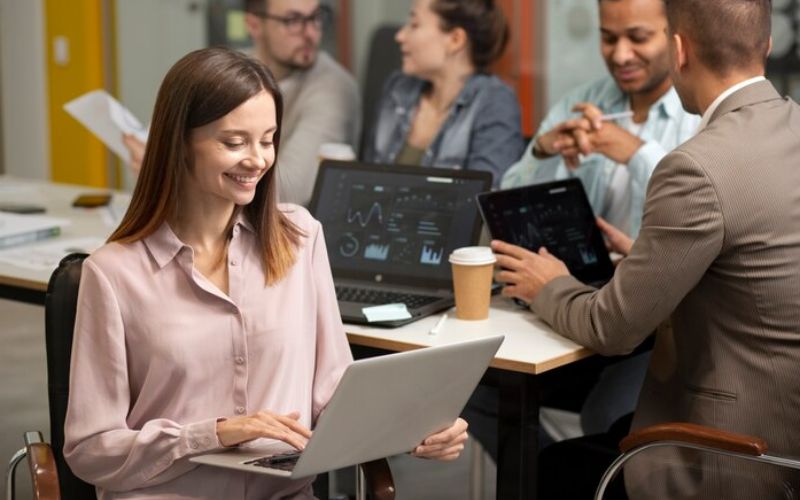 women working on a laptop